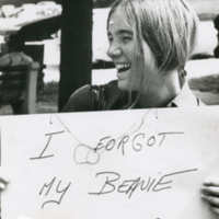 Student candid with sign