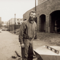 Installation of the totem sculptures outside the Student Center